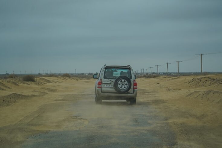 Windy with sand blowing around on the way to Yangykala Canyon in western Turkmenistan