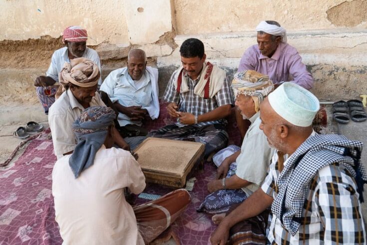 A group of old men playing dominoes in Shibam