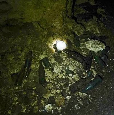 Old sake bottels inside the 1000 man. cave Peleliu